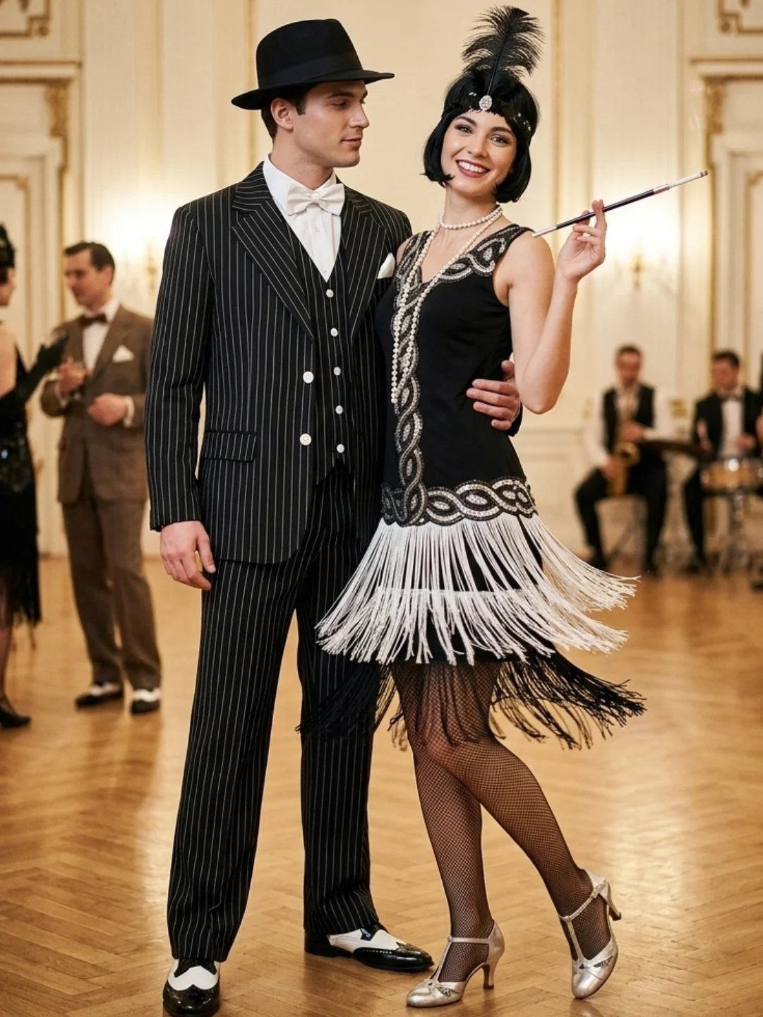 A man in a pinstripe suit and a woman in a flapper dress posing in a ballroom.